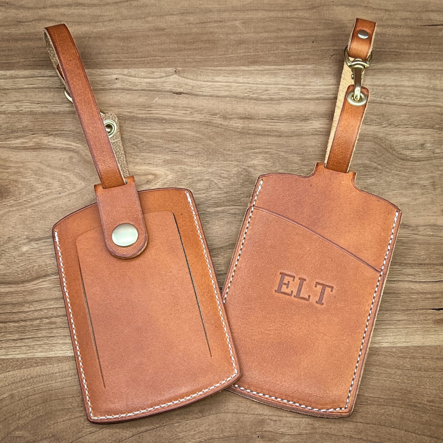 Personalized Leather Luggage Tags made in English Tan Horween Leather with white stitching and brass snap. Custom made to order in Houston, Texas by Custom Leather and Pen