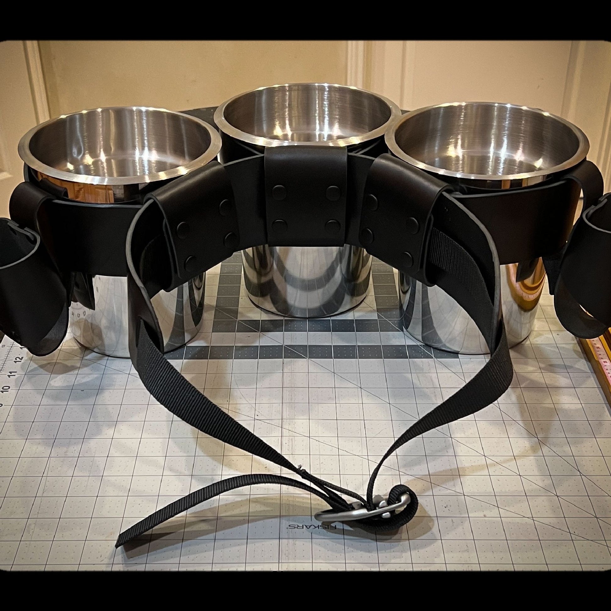 Rear view of Skipper's Oyster Shucker Belt showing the 3 / 2 configuration of pots and condiment holders.