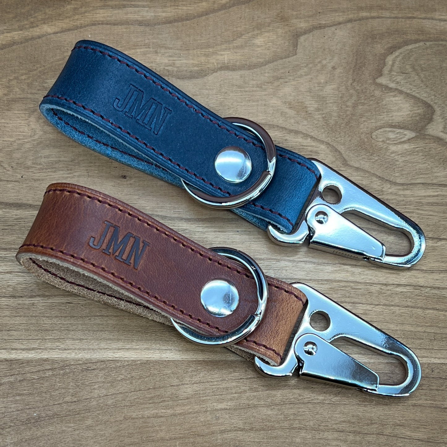Cobalt Blue and Bourbon Horween Leather keychains with premium nickel hardware.