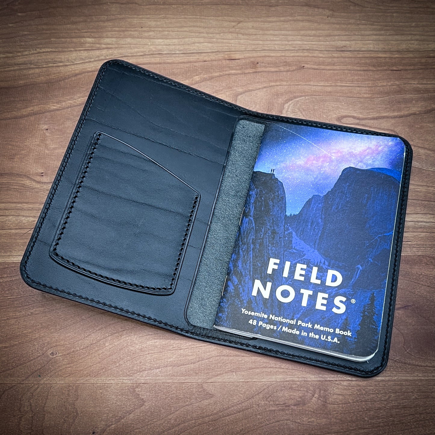 Handmade Pocket Notebook Cover in Black Splenda Leather. Interior showing business card pocket and Field Notes Pocket Notebook.