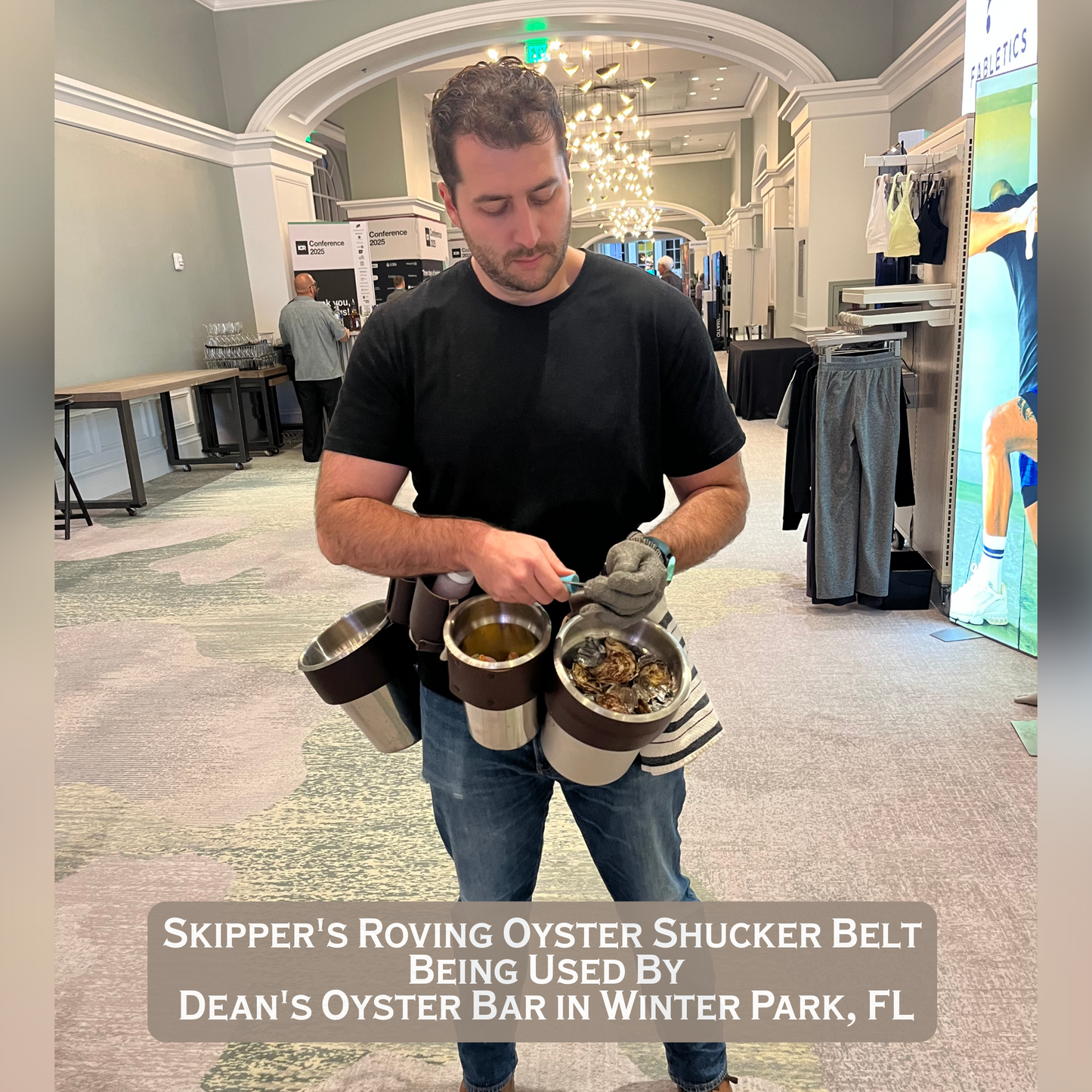 Man shucking oysters using
Skipper’s Roving Oyster Shucker Belt in a large conference