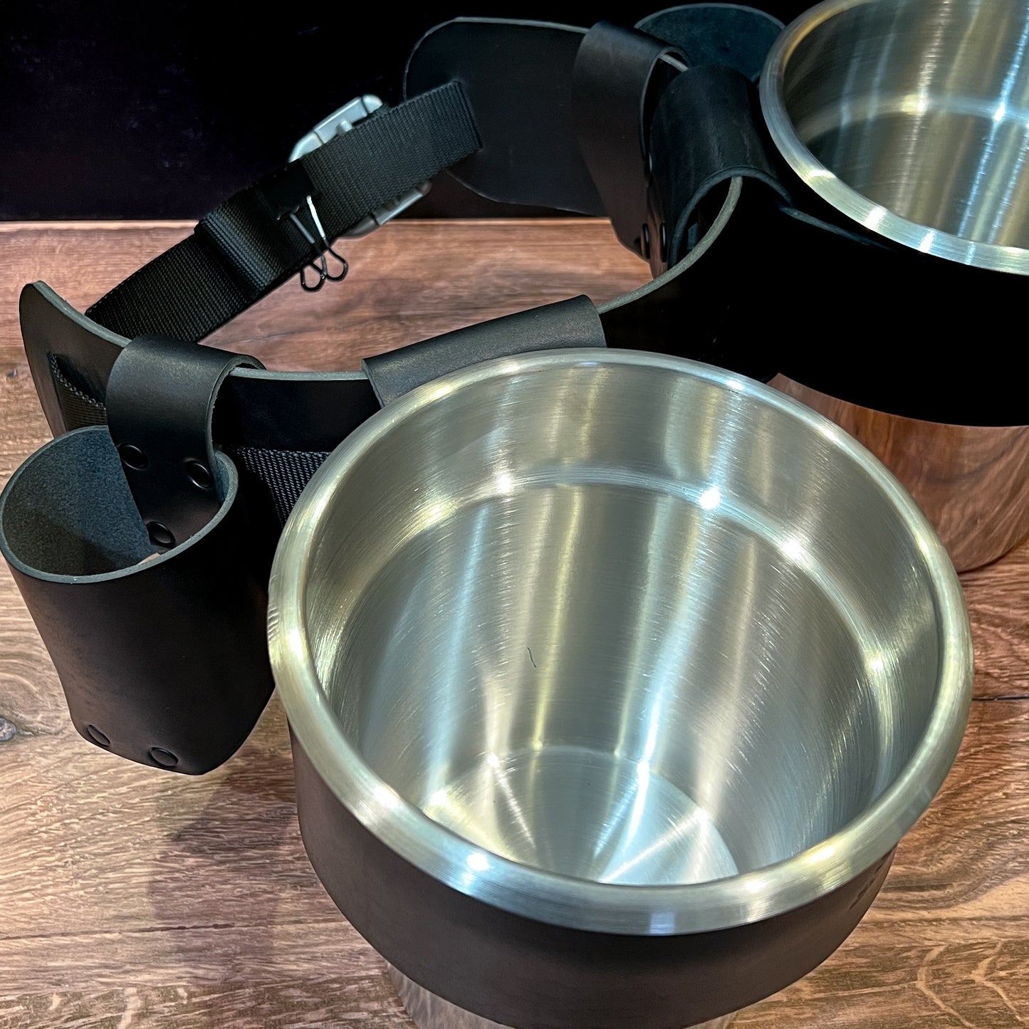 Close up of Skipper's Oyster Shucker Belt in Black Horween Leather showing a 4 quart pot and a condiment holder