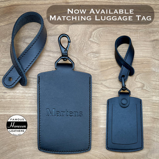 Handmade premium luggage tag in Black Horween leather with unique clip and strap options.