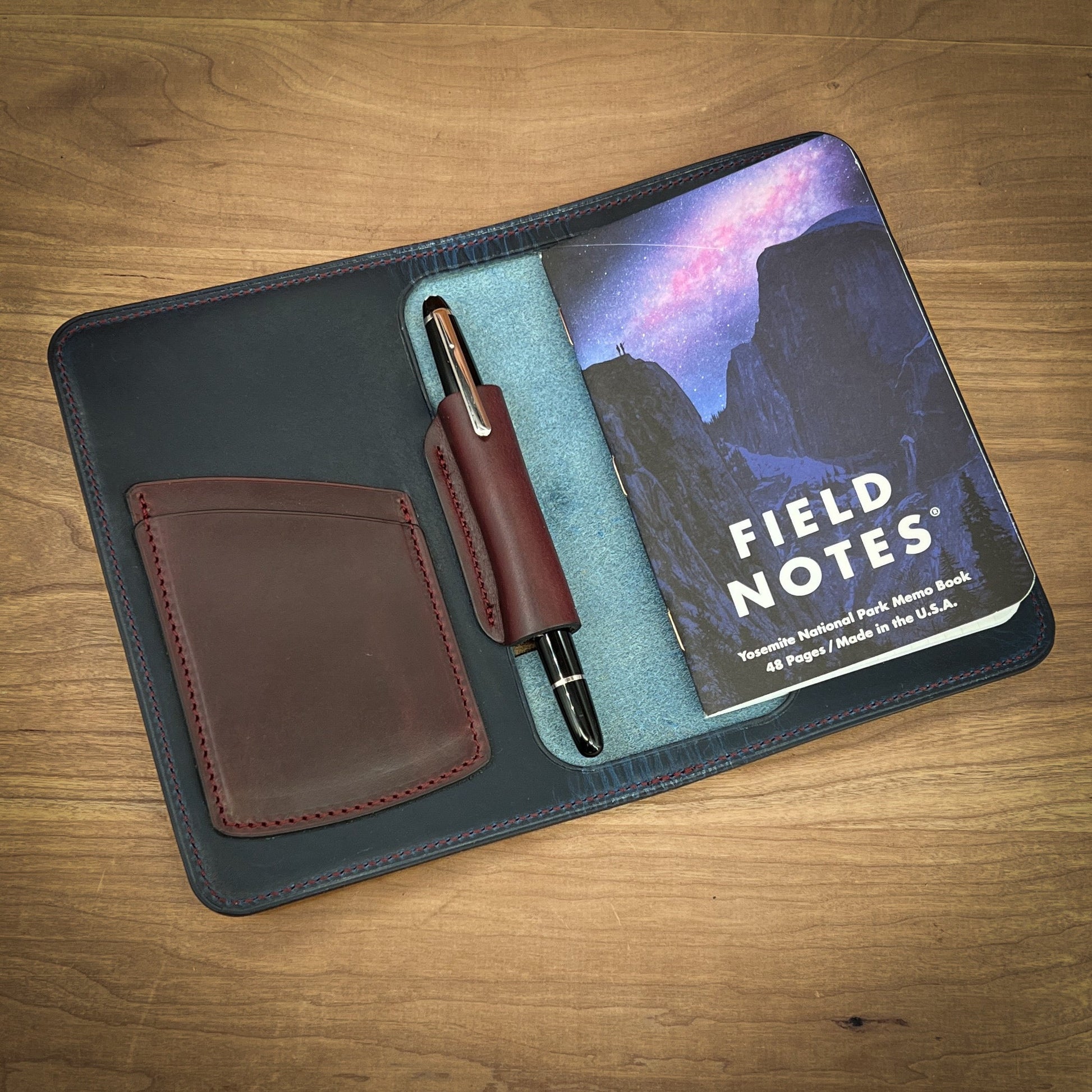 Handcrafted Pocket Size Notebook Cover in Blue Horween Leather with Burgundy Accent pockets and Black Montblanc Pen