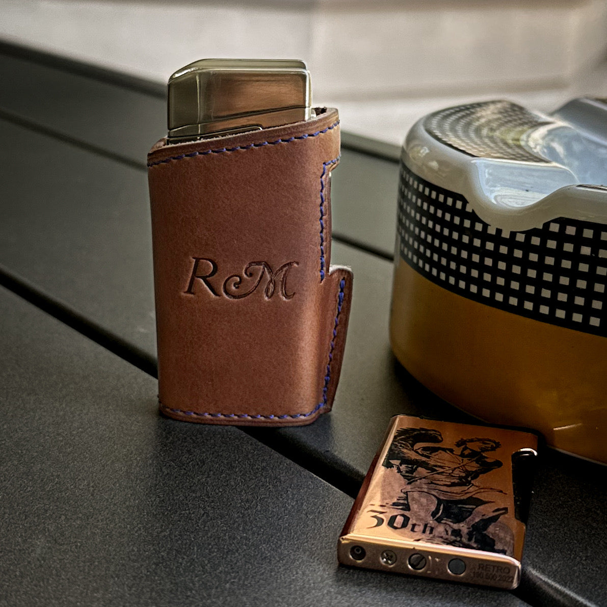Reno's Custom Leather Cigar Lighter Case in Bourbon Horween Leather with Royal Blue Stitching.  Handmade to order by Custom Leather and Pen in Houston, TX
