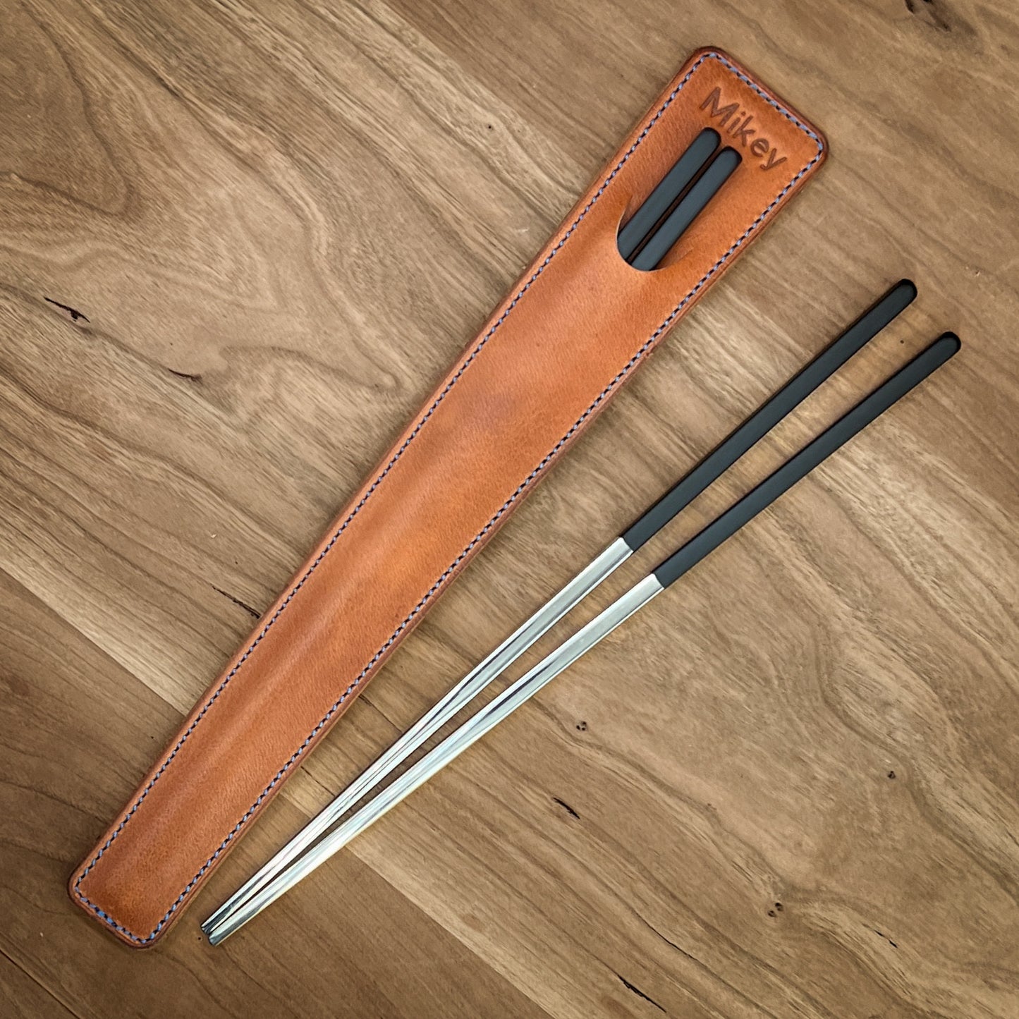Personalized chop sticks case.  handmade in Horween leather by custom leather and pen in houston, texas.