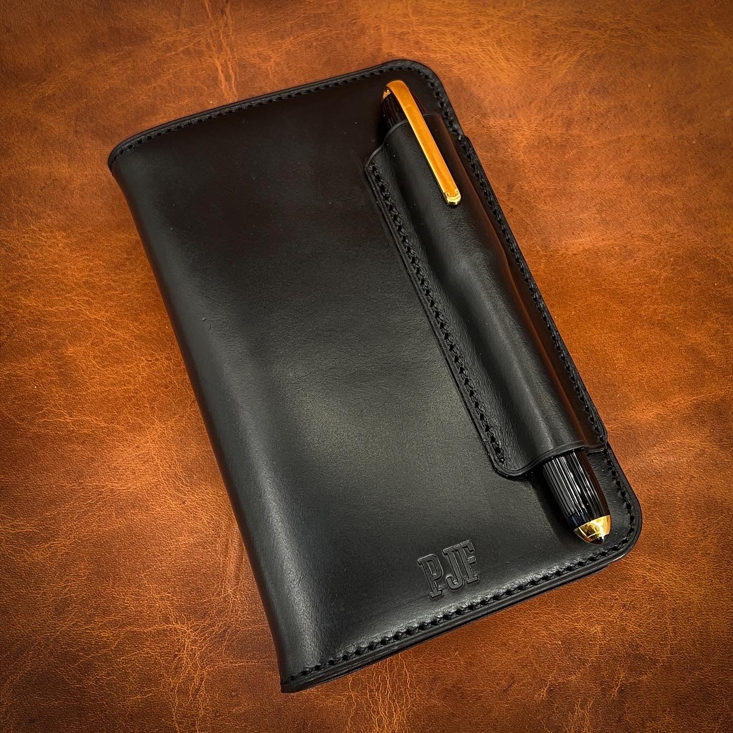Executive Style Notebook Cover with Cartier Pen in Black CXL Horween Leather.  Handmade by Custom Leather and Pen in Houston, TX