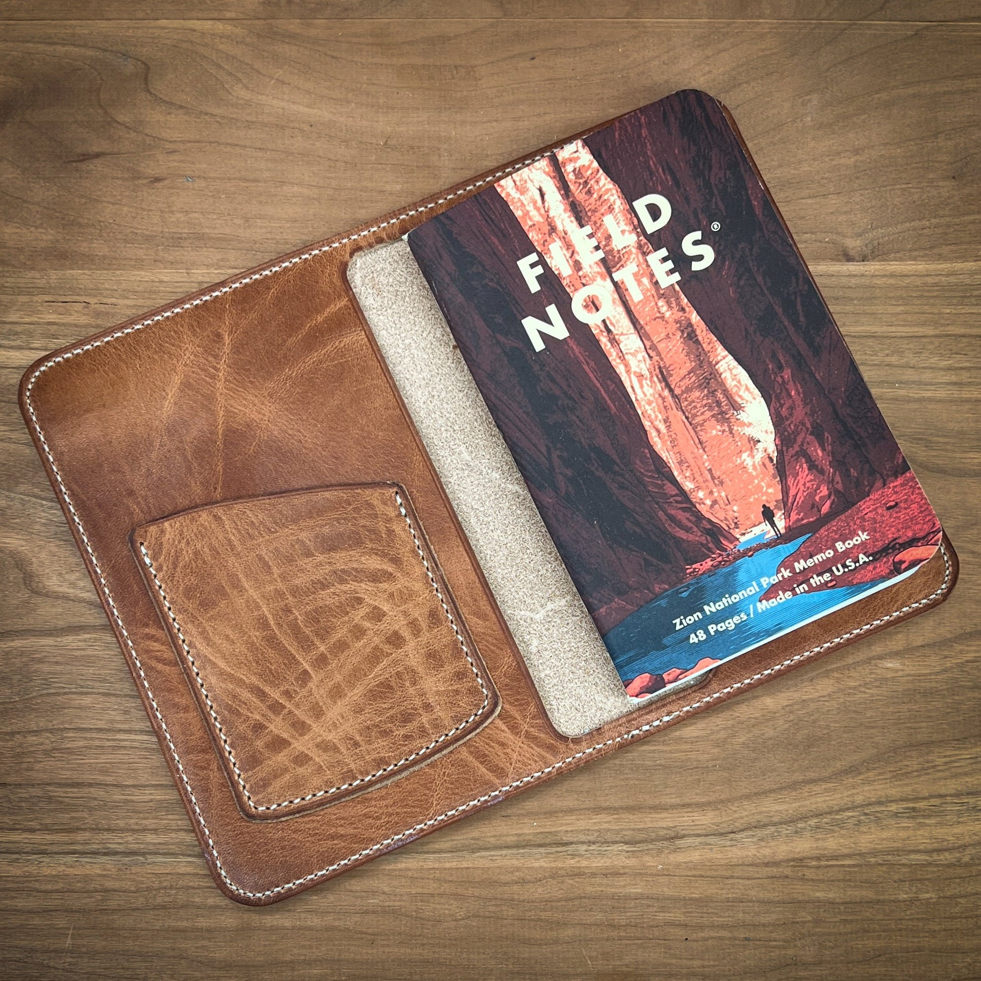 Beautiful Custom Horween Leather Notebook cover with Field Notes refill in English Tan Horween.  Made by Custom Leather and Pen in Houston, TX