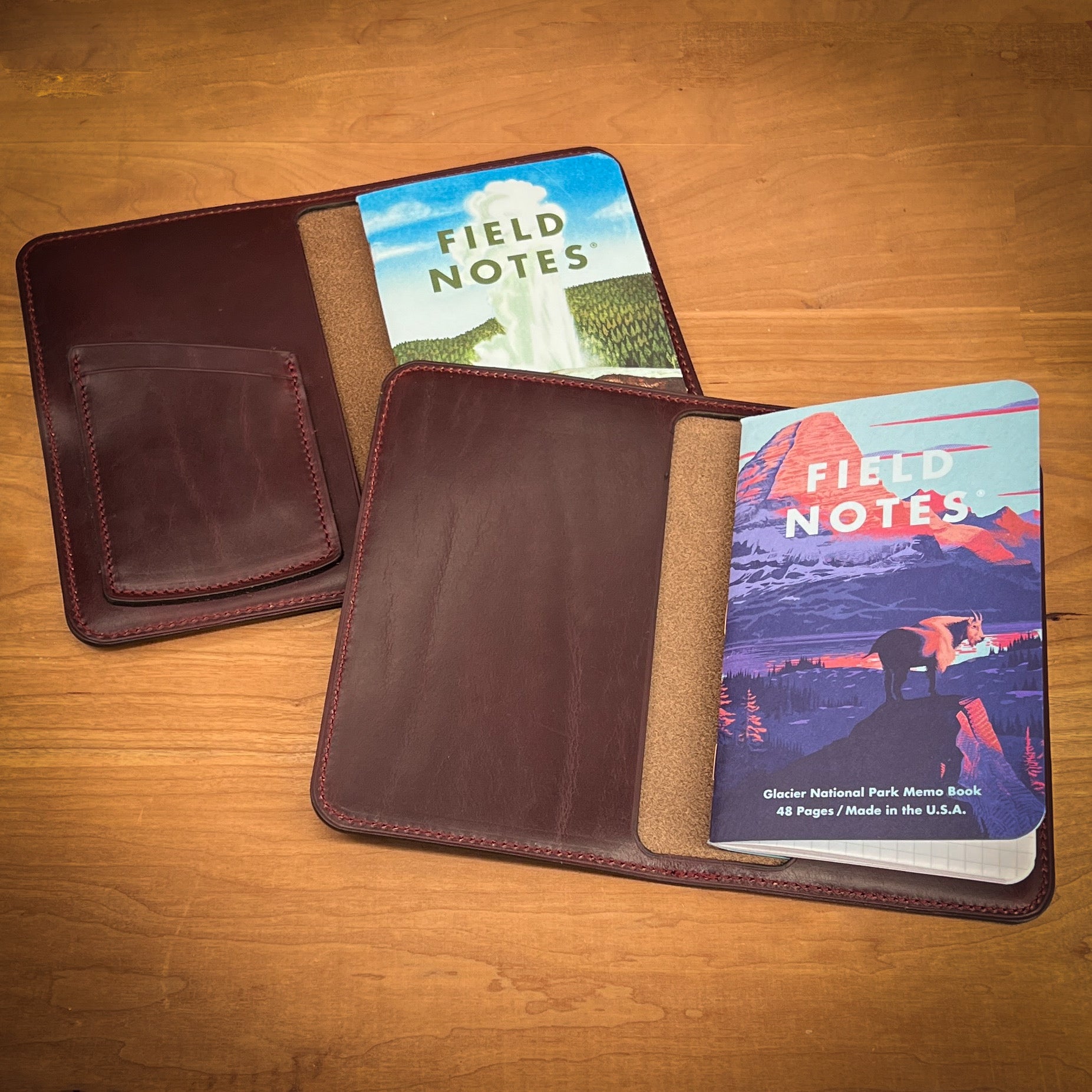 Two Russet Brown Horween Leather Notebook Covers.  One cover has two credit card pockets and the other cover has no credit card pockets.  Both covers contain Field Notes refills.  Handmade by Custom Leather and Pen in Houston, TX