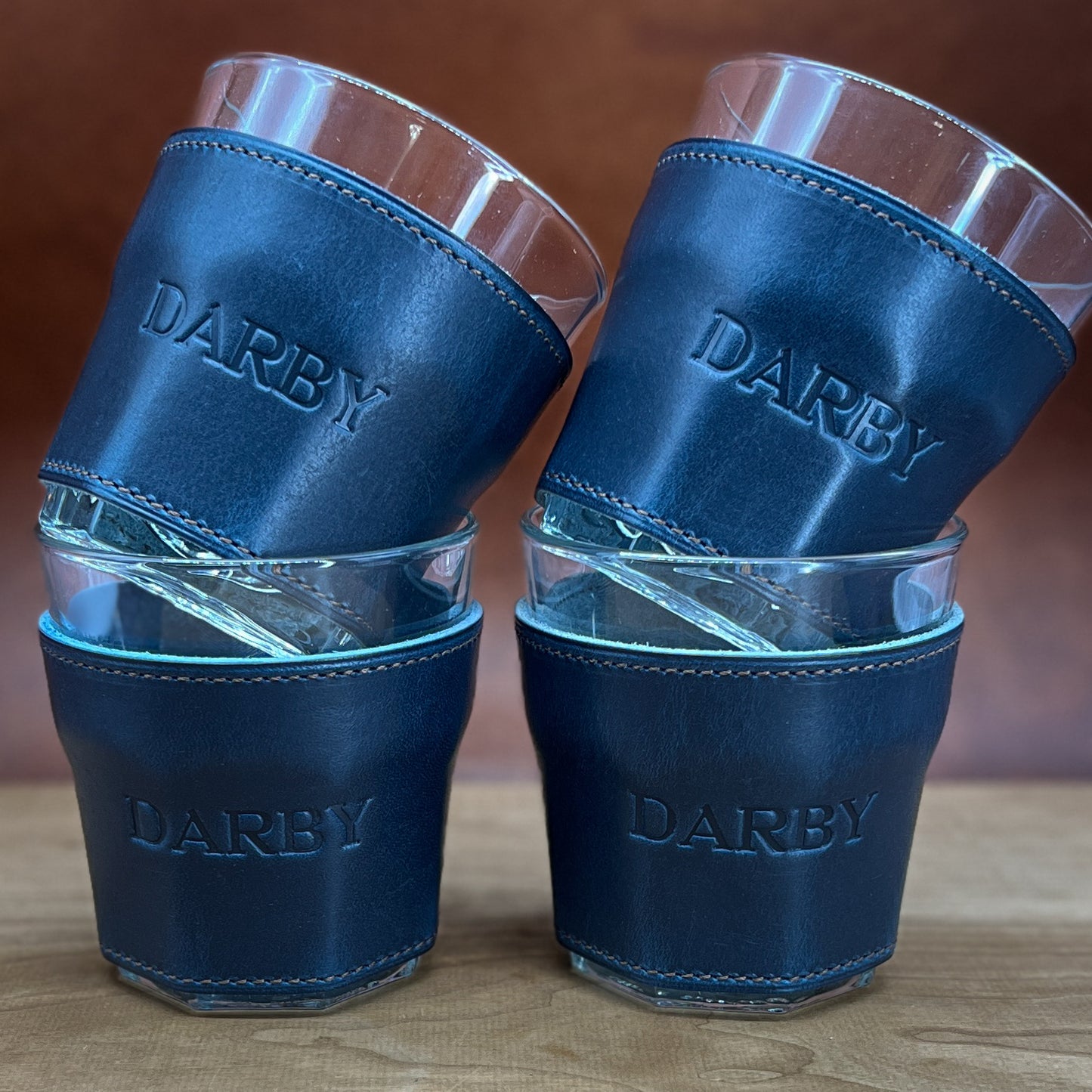 Beautiful Cobalt Blue Horween Leather Whiskey Glasses with Brown Accent Stitching in font A36.