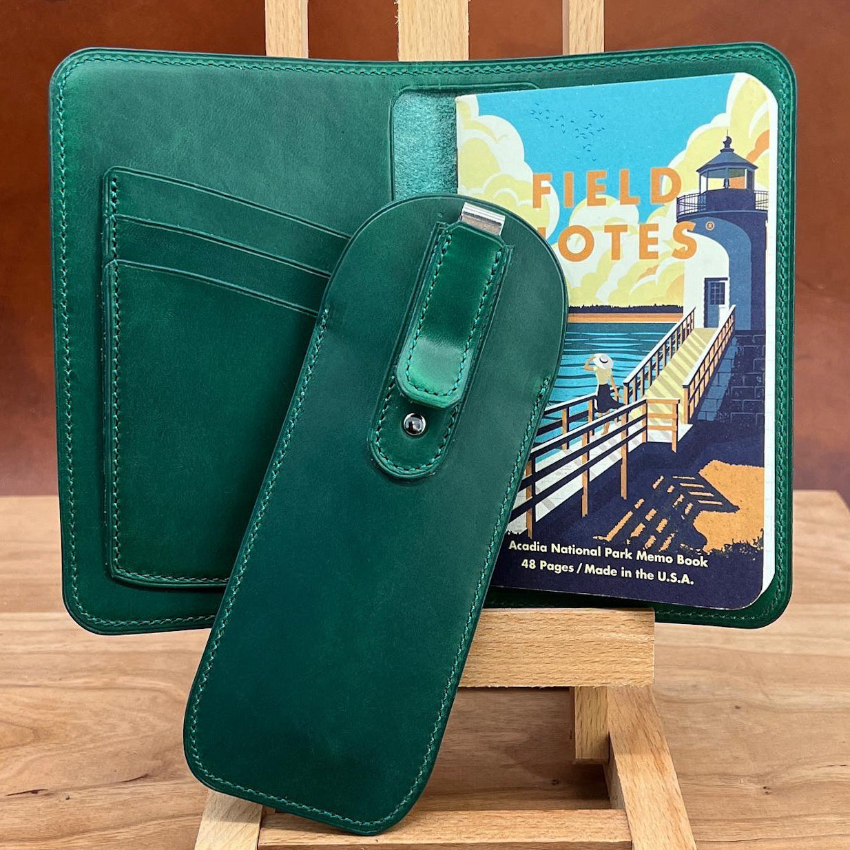 Green Horween Leather Notebook Cover with Matching Pen Holder showing the back side of the pen holder with matching leather wrapped clip.  