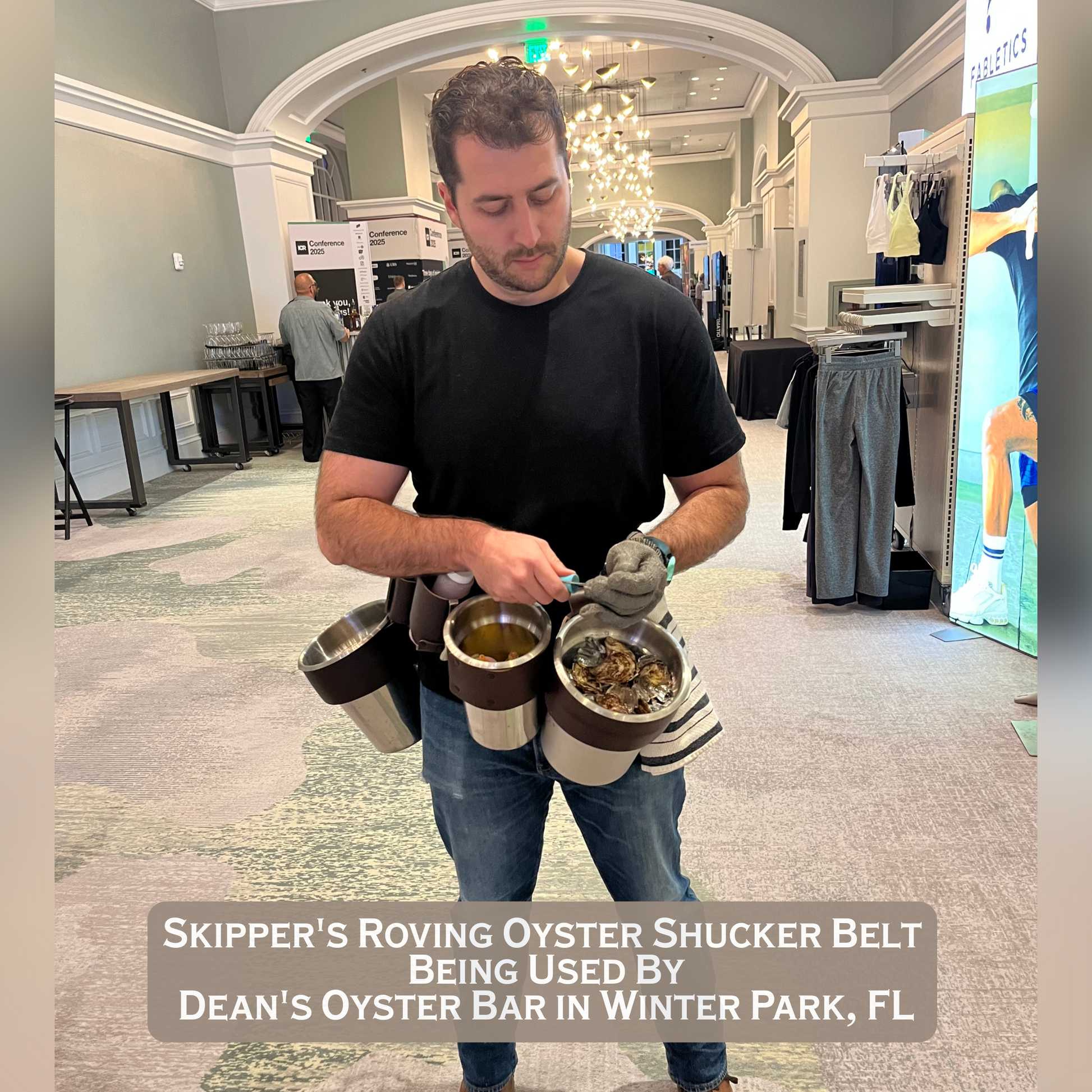 Man shucking oysters using 
 Skipper’s Roving Oyster Shucker Belt in a large conference 