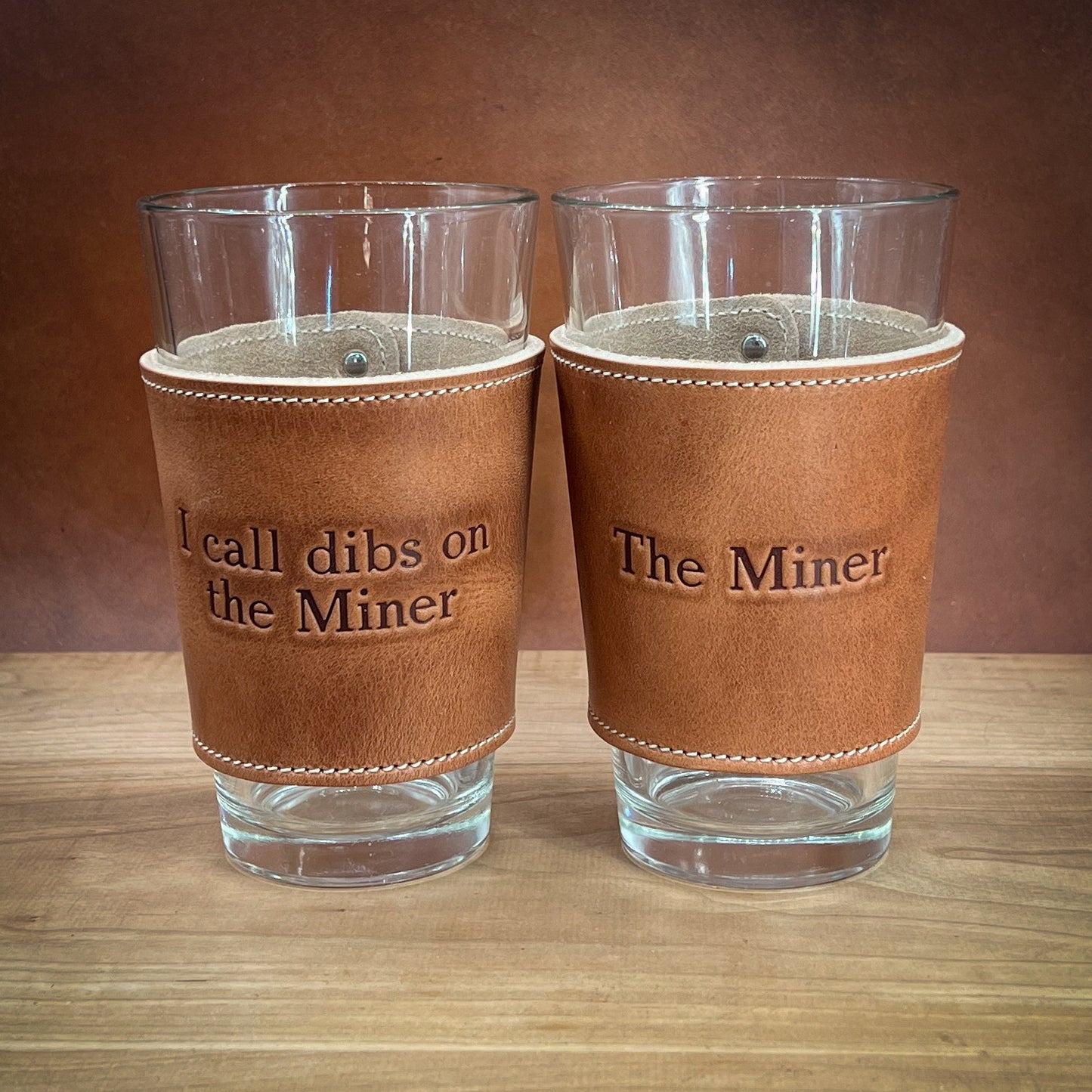 Pint Glass Sleeves with Name and Logo in American Horween Leather.  Handmade to order in Houston TX