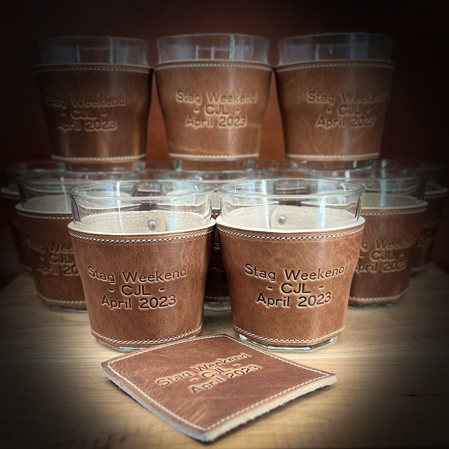 Custom Engraved Whiskey Glasses and Coasters for a bachelor party in Horween leather