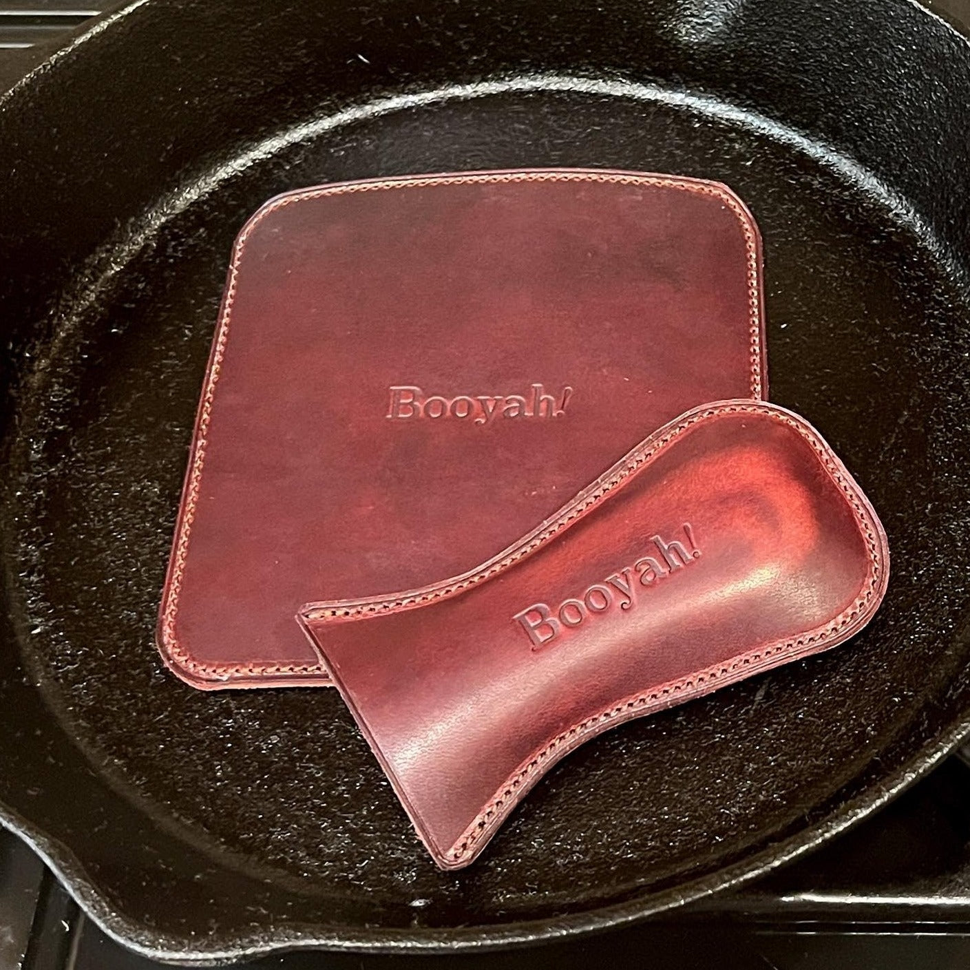 Booyah baby!  Cast Iron Skillet Handle Covers in Horween leather.  Handmade to order in Houston, TX.